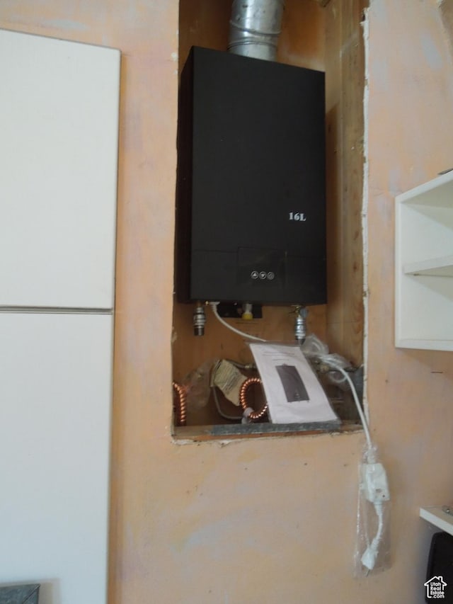 313 W Holyoak Ln, Castle Valley, UT 84532 - detailed view of water heater and freestanding refrigerator