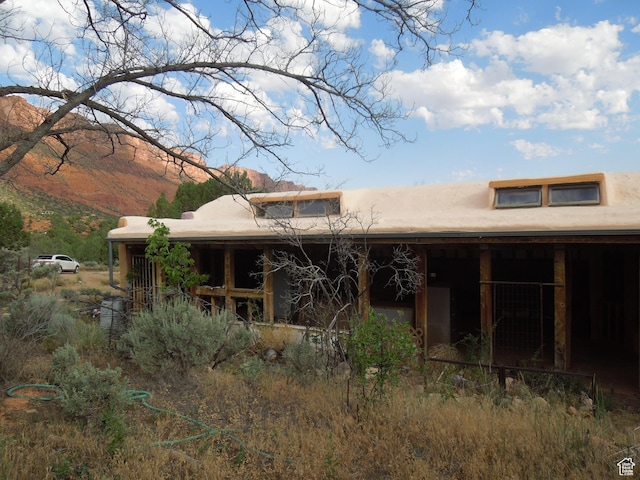 313 W Holyoak Ln, Castle Valley, UT 84532 - rear view of property with a mountain view