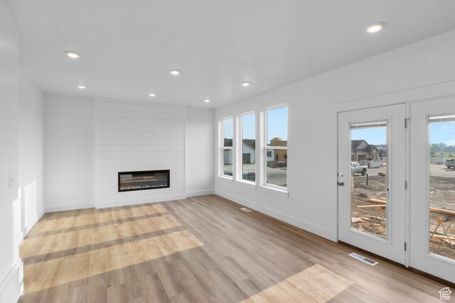 335 W 950 N Unit 9, Brigham City, UT 84302 - unfurnished living room featuring light wood-style flooring, a fireplace, and recessed lighting