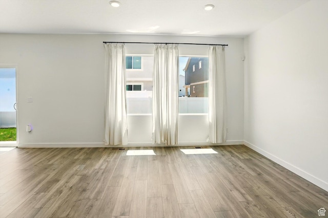 1147 E Fathom Ln, Saratoga Springs, UT 84045 - empty room featuring wood finished floors and plenty of natural light