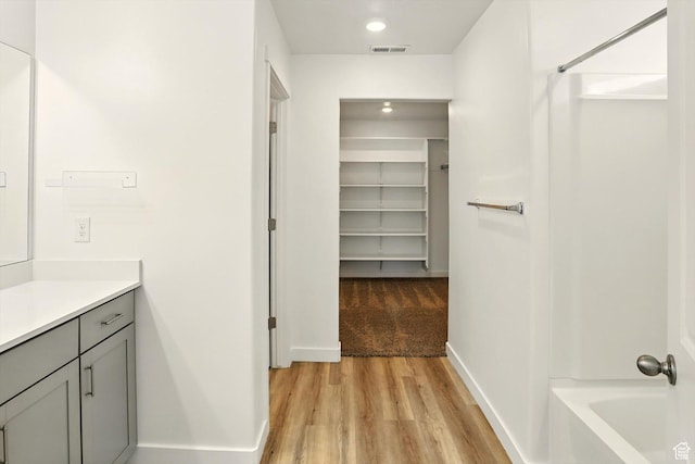 1147 E Fathom Ln, Saratoga Springs, UT 84045 - full bathroom featuring vanity, wood finished floors, a spacious closet,  shower combination, and recessed lighting