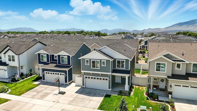 1147 E Fathom Ln, Saratoga Springs, UT 84045 - traditional home featuring a residential view, an attached garage, a mountain view, and driveway