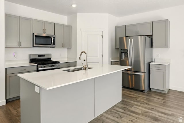 1147 E Fathom Ln, Saratoga Springs, UT 84045 - kitchen featuring stainless steel appliances, gray cabinets, wood finished floors, and recessed lighting