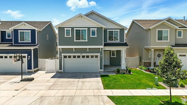 1147 E Fathom Ln, Saratoga Springs, UT 84045 - craftsman-style home featuring a gate, an attached garage, and concrete driveway