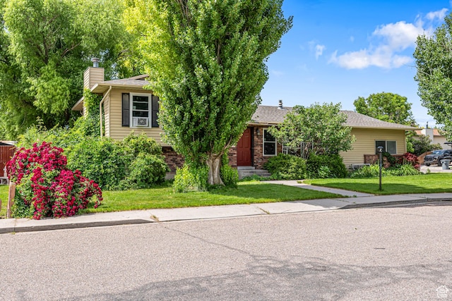 462 E 370 N, Delta, UT 84624 - view of property hidden behind natural elements with a chimney and a front yard