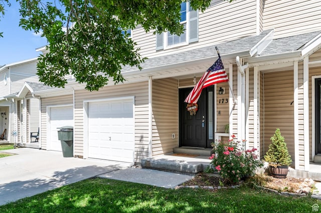 1738 N Brett St, Tooele, UT 84074 - doorway to property with concrete driveway and roof with shingles