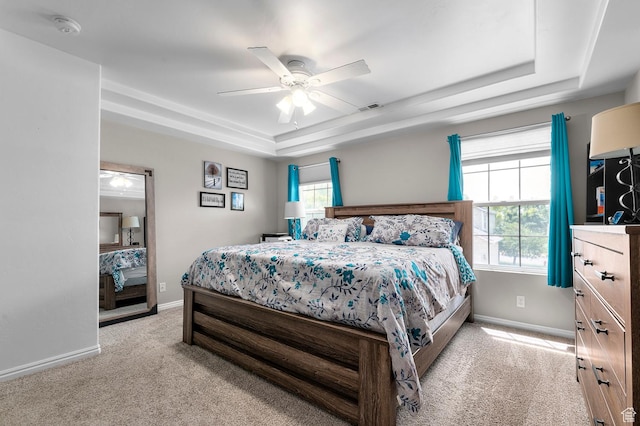1738 N Brett St, Tooele, UT 84074 - bedroom featuring a tray ceiling, light carpet, and ceiling fan
