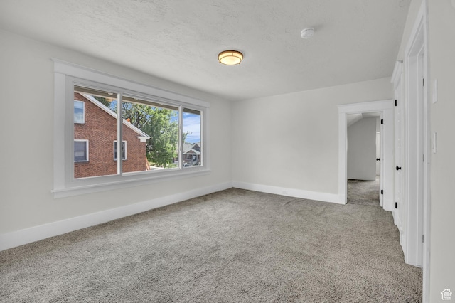 2546 S Fowler, Ogden, UT 84401 - carpeted empty room featuring baseboards and a smoke detector