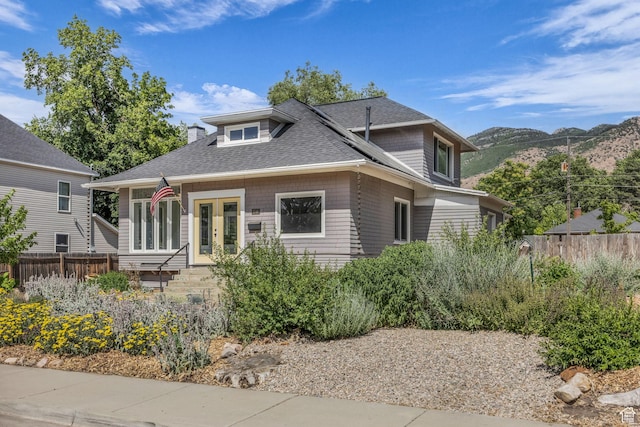 2546 S Fowler, Ogden, UT 84401 - view of front of home with a mountain view, roof with shingles, and french doors