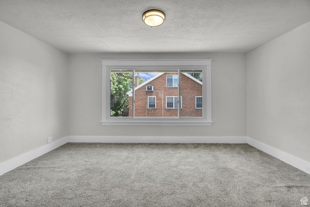2546 S Fowler, Ogden, UT 84401 - unfurnished room with carpet and a textured ceiling