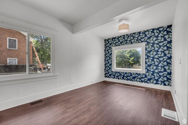 2546 S Fowler, Ogden, UT 84401 - unfurnished room featuring plenty of natural light, wallpapered walls, and dark wood finished floors