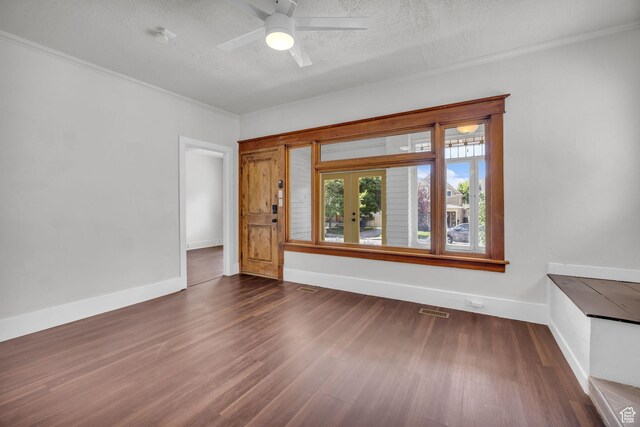 2546 S Fowler, Ogden, UT 84401 - empty room with wood finished floors, ornamental molding, ceiling fan, and a textured ceiling