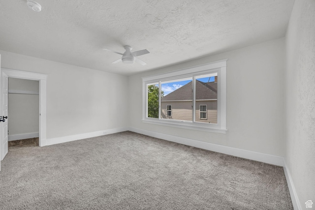 2546 S Fowler, Ogden, UT 84401 - carpeted spare room with ceiling fan, a textured ceiling, and a smoke detector