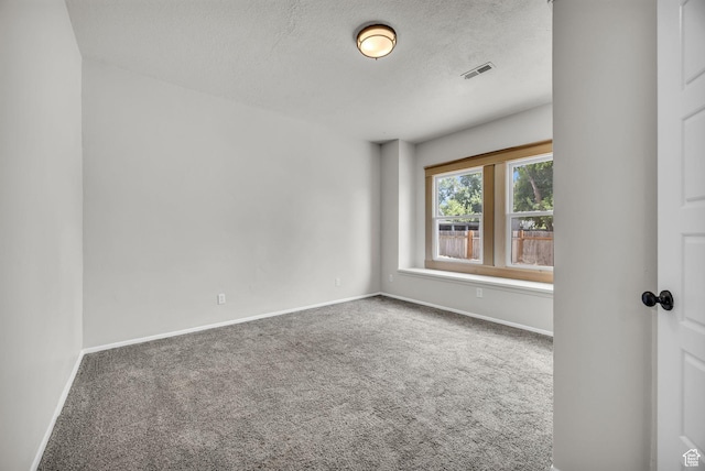 2546 S Fowler, Ogden, UT 84401 - spare room featuring carpet and a textured ceiling