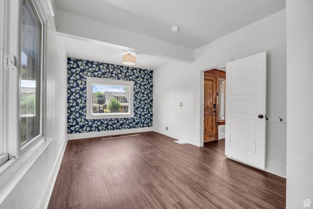 2546 S Fowler, Ogden, UT 84401 - unfurnished room featuring dark wood finished floors, wallpapered walls, and a smoke detector