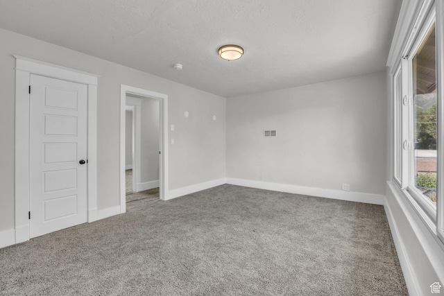 2546 S Fowler, Ogden, UT 84401 - spare room with carpet flooring and a smoke detector