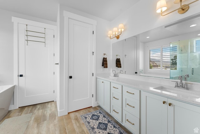 1872 S 250 W, Lehi, UT 84043 - full bathroom with a shower stall, double vanity, wood finished floors, a freestanding bath, and recessed lighting