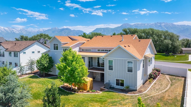 1872 S 250 W, Lehi, UT 84043 - back of house with board and batten siding, a mountain view, and a fenced backyard