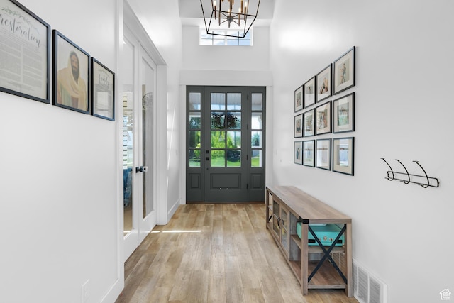 1872 S 250 W, Lehi, UT 84043 - entryway with wood finished floors, a chandelier, and a towering ceiling
