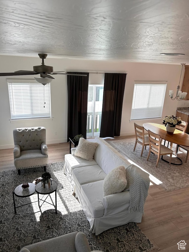 4728 E Lake Corner Dr, Eagle Mountain, UT 84005 - living area with light wood-type flooring, plenty of natural light, and ceiling fan