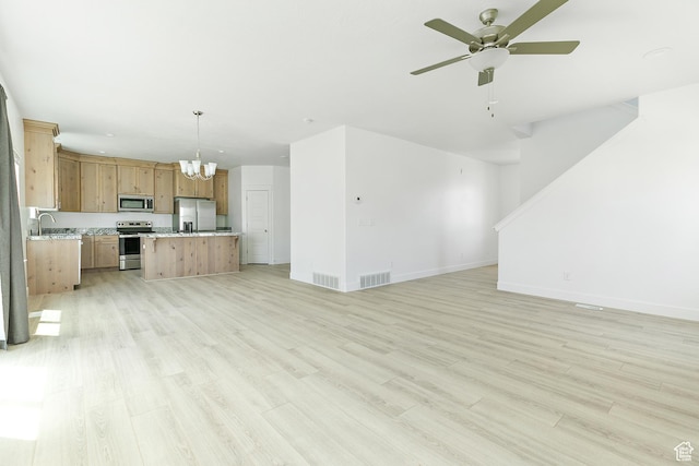 4728 E Lake Corner Dr, Eagle Mountain, UT 84005 - unfurnished living room with ceiling fan, a chandelier, and light wood finished floors