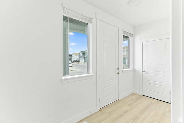4728 E Lake Corner Dr, Eagle Mountain, UT 84005 - entryway featuring light wood-style floors and baseboards