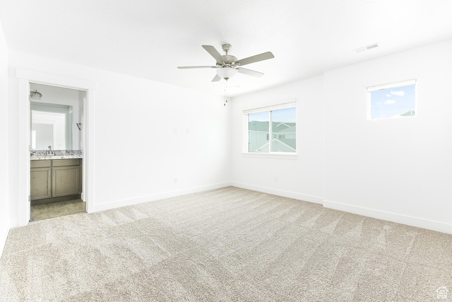 4728 E Lake Corner Dr, Eagle Mountain, UT 84005 - unfurnished bedroom with light colored carpet, ensuite bathroom, and ceiling fan