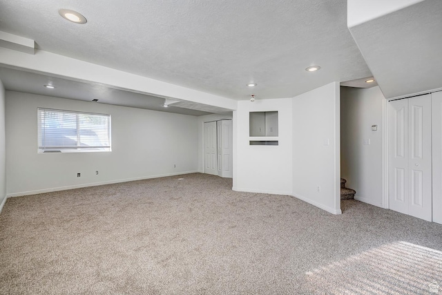 4689 W Nebo Dr S, West Jordan, UT 84088 - below grade area with carpet, recessed lighting, stairs, and a textured ceiling