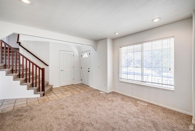4689 W Nebo Dr S, West Jordan, UT 84088 - tiled foyer entrance featuring carpet floors, stairway, and recessed lighting