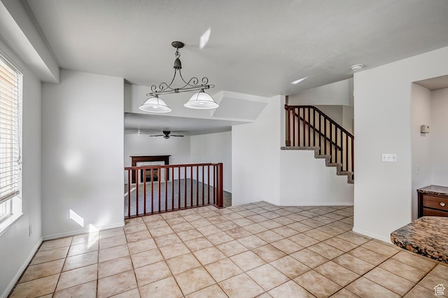 4689 W Nebo Dr S, West Jordan, UT 84088 - spare room featuring a ceiling fan, light tile patterned flooring, a smoke detector, and plenty of natural light
