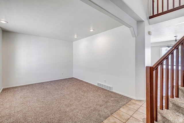 4689 W Nebo Dr S, West Jordan, UT 84088 - unfurnished room featuring light colored carpet, recessed lighting, and light tile patterned floors