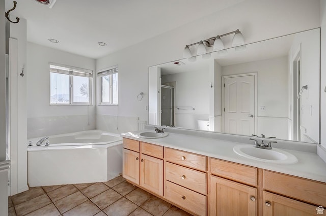 4689 W Nebo Dr S, West Jordan, UT 84088 - full bathroom featuring a bath, double vanity, a shower stall, and tile patterned floors