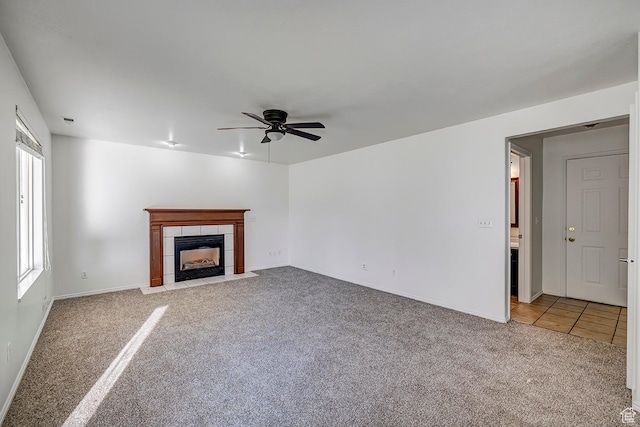4689 W Nebo Dr S, West Jordan, UT 84088 - unfurnished living room featuring light carpet, ceiling fan, and a tile fireplace