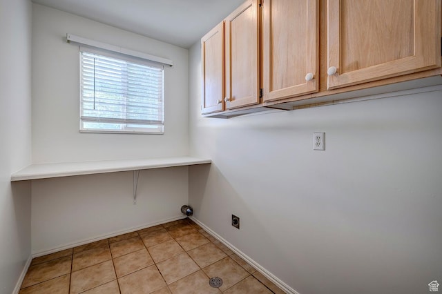 4689 W Nebo Dr S, West Jordan, UT 84088 - laundry area featuring cabinet space, hookup for an electric dryer, and light tile patterned floors