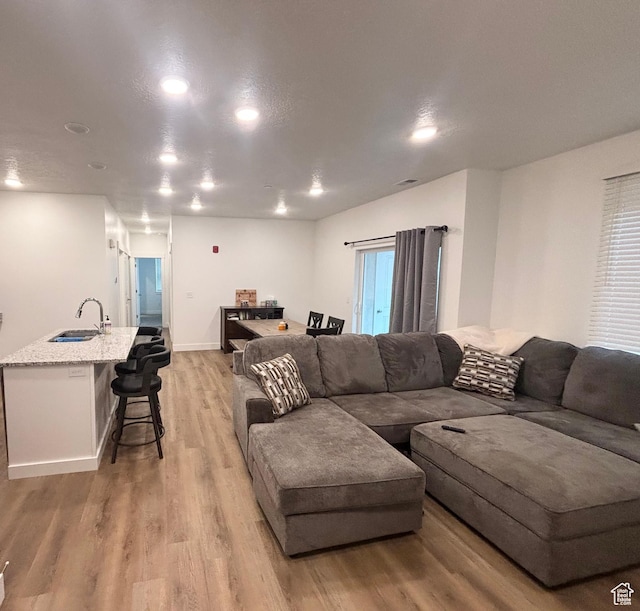 460 W 15 S Unit G201, Providence, UT 84332 - living area featuring light wood-type flooring and recessed lighting