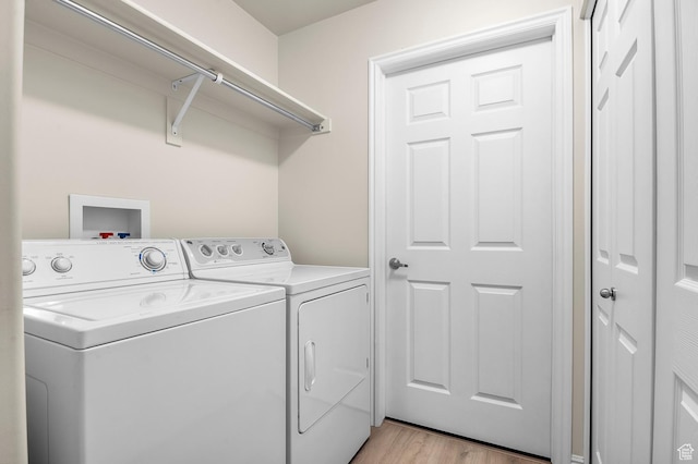 9213 S 2040 W Unit C, West Jordan, UT 84088 - laundry area with washer and clothes dryer and light wood-style floors