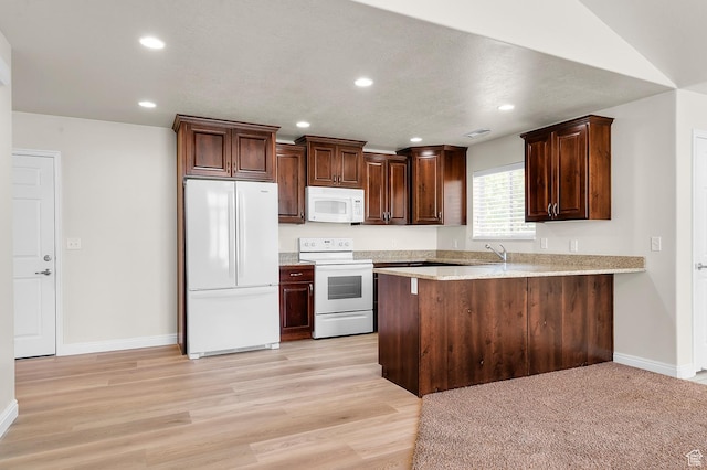 9213 S 2040 W Unit C, West Jordan, UT 84088 - kitchen with white appliances, a peninsula, light wood finished floors, dark brown cabinetry, and recessed lighting