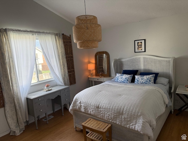 334 W 100 N, Clearfield, UT 84015 - bedroom with wood finished floors and vaulted ceiling