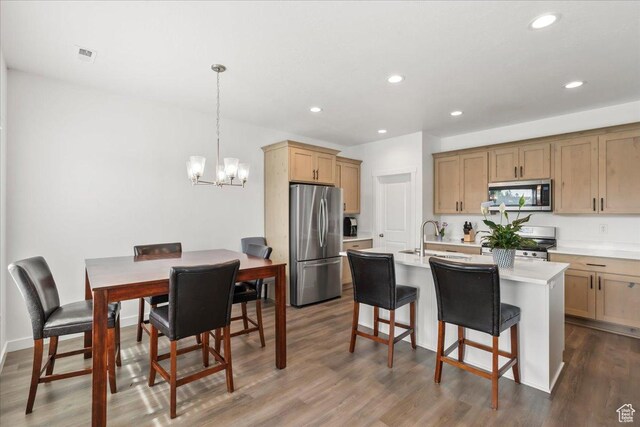 4113 S 3560 W, West Haven, UT 84401 - kitchen with stainless steel appliances, light countertops, a chandelier, recessed lighting, and dark wood-style flooring