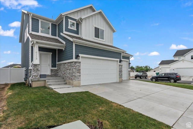 4113 S 3560 W, West Haven, UT 84401 - view of front of property featuring board and batten siding, a garage, stone siding, and concrete driveway