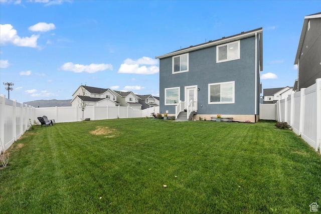 4113 S 3560 W, West Haven, UT 84401 - back of property with a fenced backyard, stucco siding, and entry steps