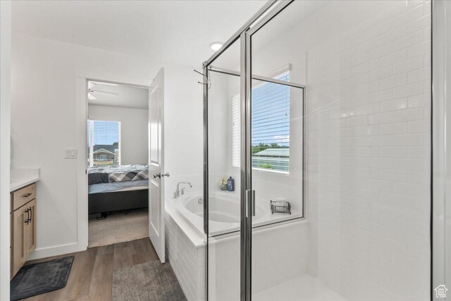 4113 S 3560 W, West Haven, UT 84401 - bathroom with wood finished floors, a shower stall, vanity, ensuite bath, and a bath