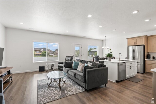 4113 S 3560 W, West Haven, UT 84401 - living area with dark wood finished floors, healthy amount of natural light, recessed lighting, and a chandelier