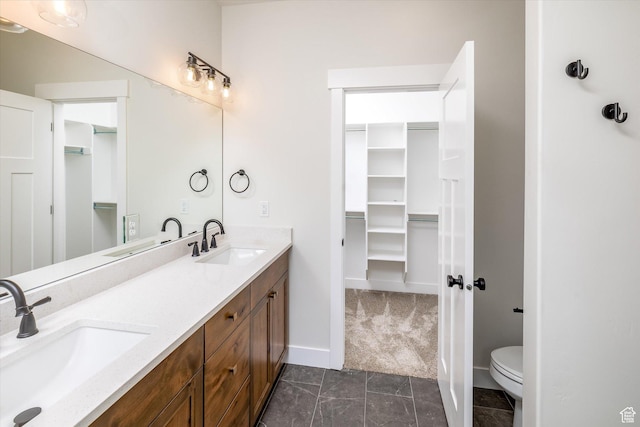 156 N Sherwood Dr, Providence, UT 84332 - bathroom with double vanity and a walk in closet