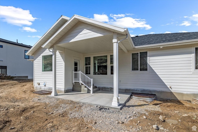 156 N Sherwood Dr, Providence, UT 84332 - rear view of property featuring a patio and roof with shingles