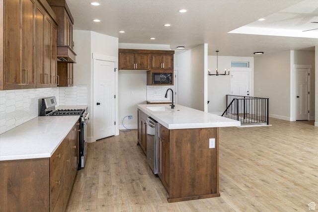156 N Sherwood Dr, Providence, UT 84332 - kitchen with appliances with stainless steel finishes, recessed lighting, backsplash, light wood-type flooring, and light countertops