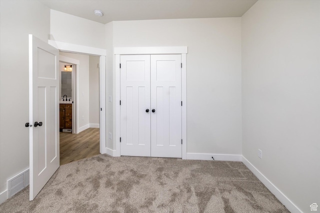 156 N Sherwood Dr, Providence, UT 84332 - unfurnished bedroom with carpet and a closet