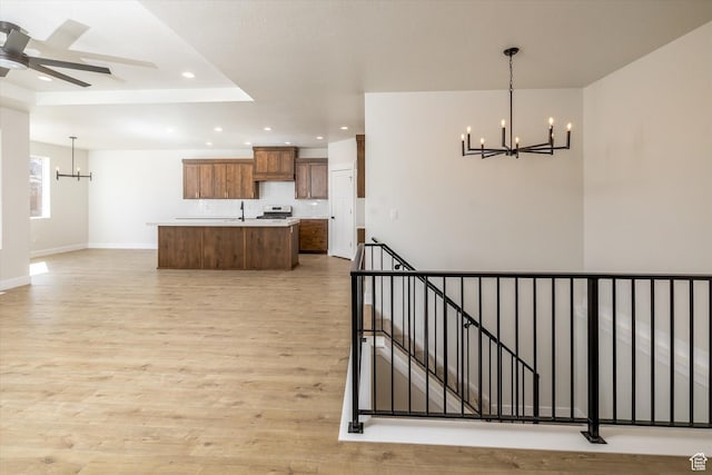 156 N Sherwood Dr, Providence, UT 84332 - kitchen featuring a chandelier, a center island with sink, light countertops, light wood-style floors, and recessed lighting