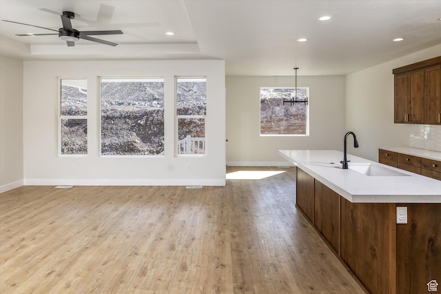 156 N Sherwood Dr, Providence, UT 84332 - kitchen featuring light countertops, open floor plan, recessed lighting, light wood-type flooring, and a kitchen island with sink