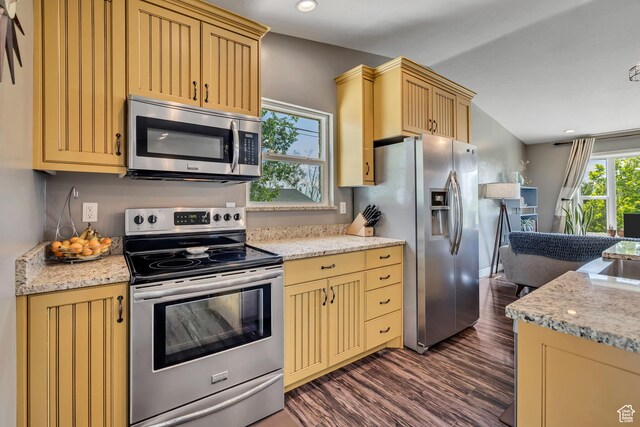 470 Hiland Rd, Ogden, UT 84404 - kitchen featuring stainless steel appliances, dark wood-type flooring, cream cabinetry, recessed lighting, and light stone counters